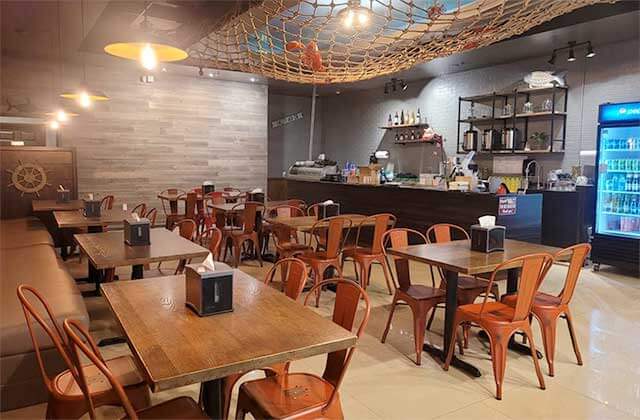 restaurant interior with tables chairs and nautical theme decor at crack n roll restaurant kissimmee