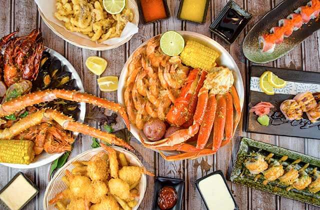 view from above of buffet with different seafood and sushi selections at crack n roll restaurant kissimmee