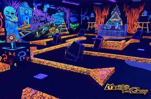 black light mini golf indoor course with spooky elements at monster mini golf coral springs