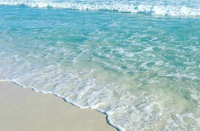 blue green water and surf foam at destin for relax on a beach page