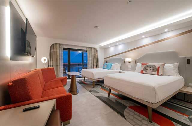 incredibles themed hotel room with red mid-century furniture at walt disney world resorts