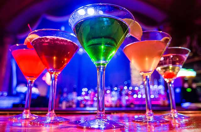 five colorful martini glasses on bar top jewel speak easy bar orlando enjoy florida