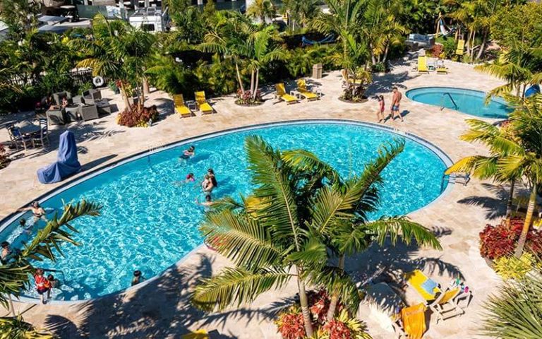 aerial of pool area with hot tub and swimmers in rv area at sugarloaf key key west koa holiday