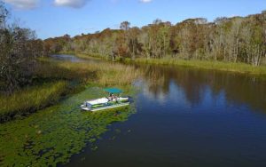 open waterway with pontoon boat fishing guide for monster bass fishing charters