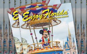 stacks of magazines with mickey mouse character in hot air balloon parade float with disney castle at magic kingdom for enjoy florida magazine