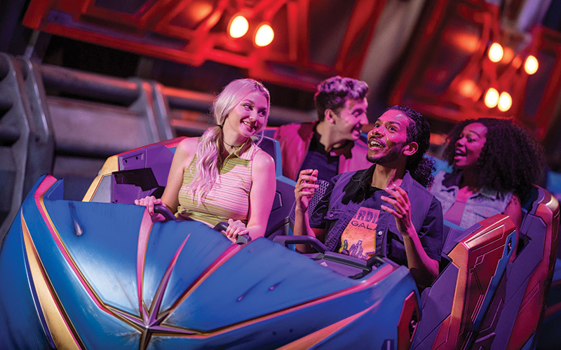 couples riding coaster indoor with purple and red lighting at cosmic rewind guardians of the galaxy epcot disney park