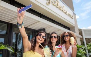 three ladies taking selfie outside shopping mall at dania pointe fort lauderdale