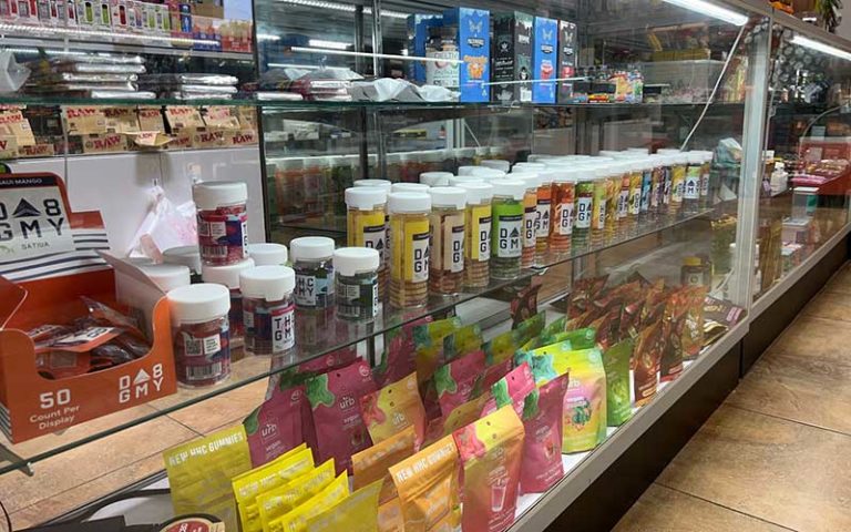 rows of cbd and tobacco products at airport liquor orlando