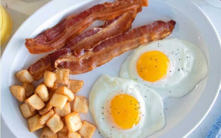 bacon eggs potatoes on white platter at shoneys kitchen and bar old town