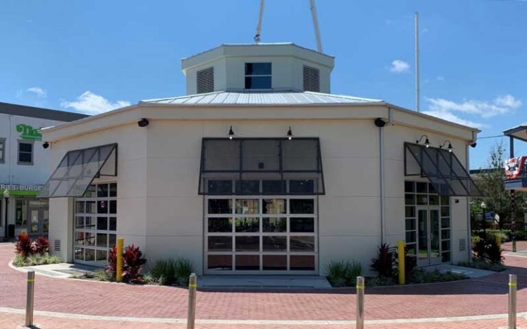 front exterior with lift top doors in plaza at bobbys garage bar in old town