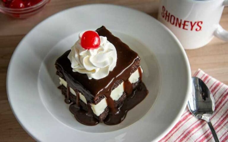 fudge brownie sundae in white bowl with logo mug at shoneys kitchen and bar old town