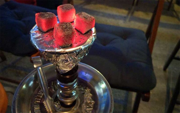 hookah tray with coals and silver tongs at perfectos lounge orlando