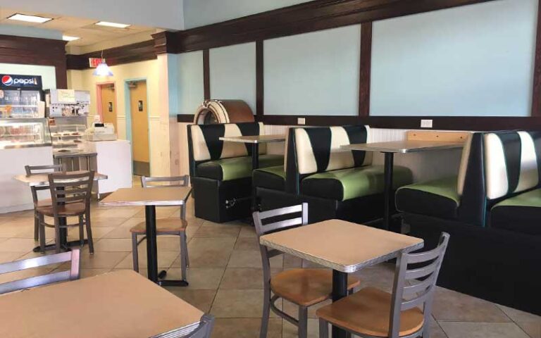 interior dining area cafe with tables chairs and booth blue and green decor at sweet dreams cafe old town