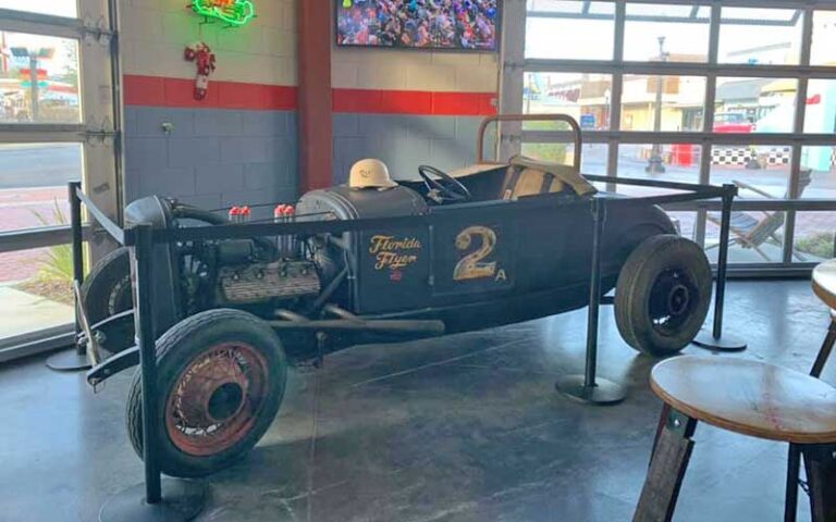 interior of dining area with displayed vintage race car at bobbys garage bar in old town