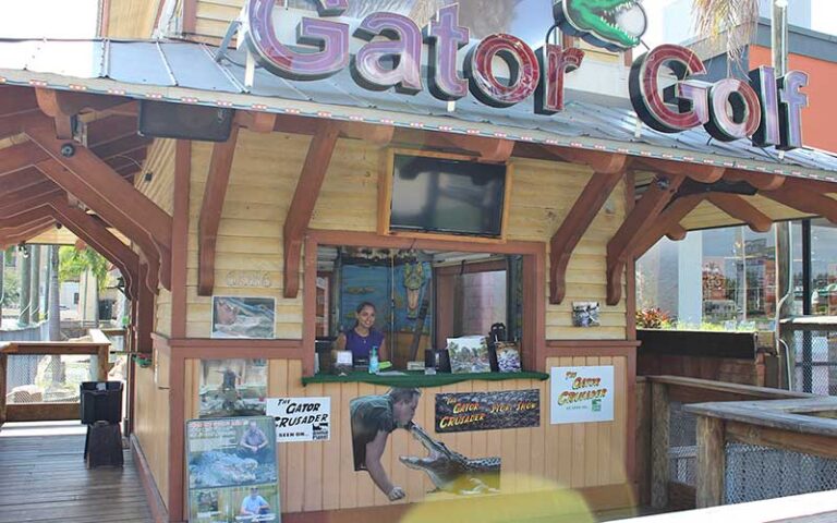 service desk with lady and signs with alligators at gator golf adventure park orlando