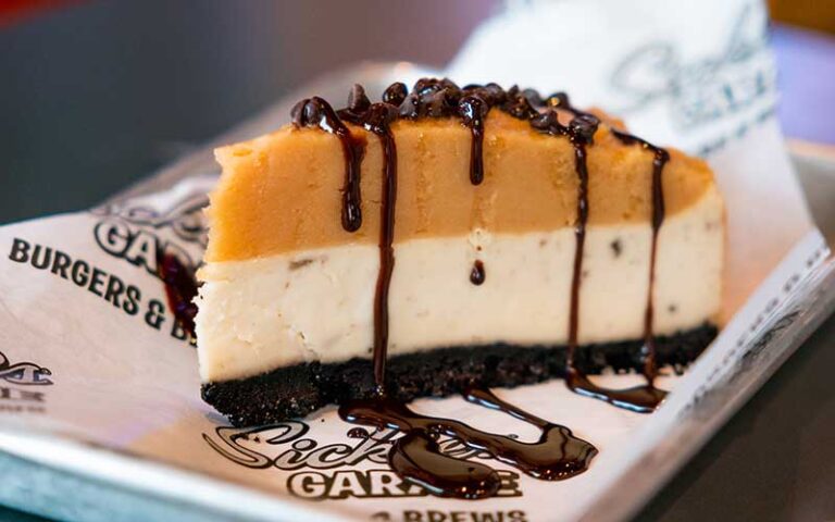 slice of peanut butter pie with fudge dripping at sickies garage burgers and brews kissimmee