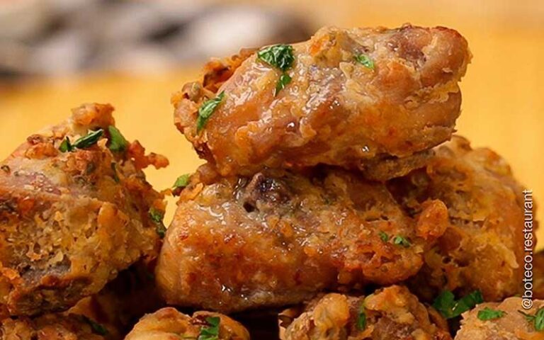 stack of meat nuggets with green herbs at boteco restaurant orlando