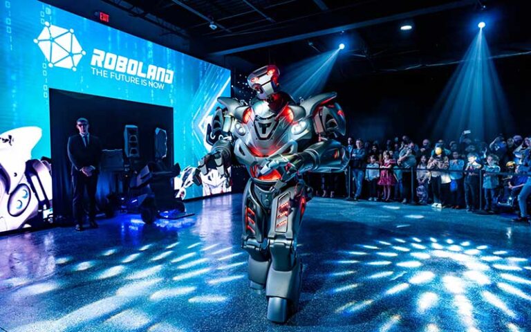 titan robot with red lights on stage with blue lighting effects at roboland orlando