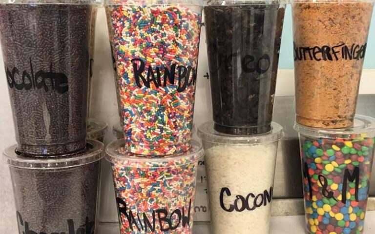 two rows of four each sprinkles tubs for ice cream at old town ice cream company