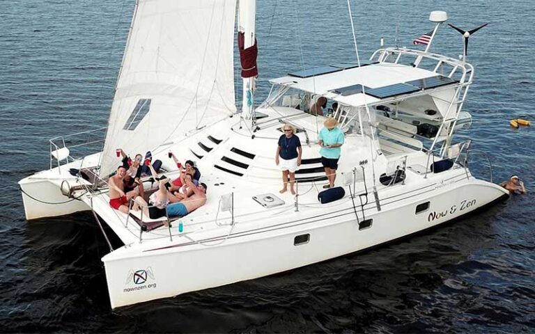 aerial of boat with group on deck at now and zen sailboat charters jacksonville