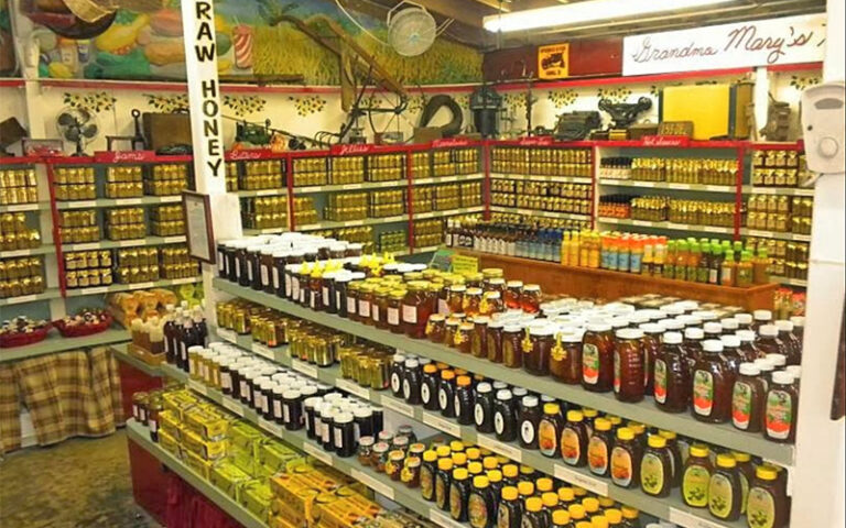 aisles of indoor store with varieties of honey at robert is here fruit stand homestead