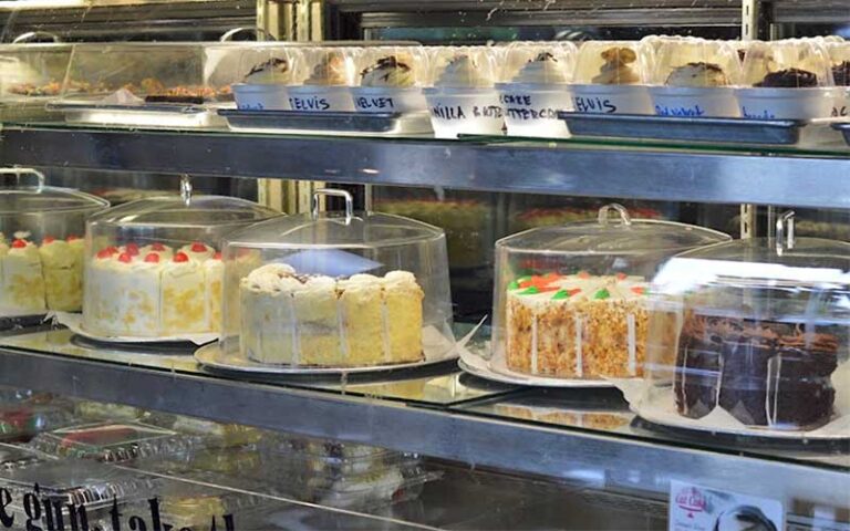 bakery case with cakes and desserts at carmines pie house jacksonville