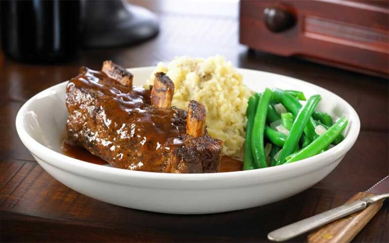 braised ribs with rice and green beans plated at teds montana grill jacksonville