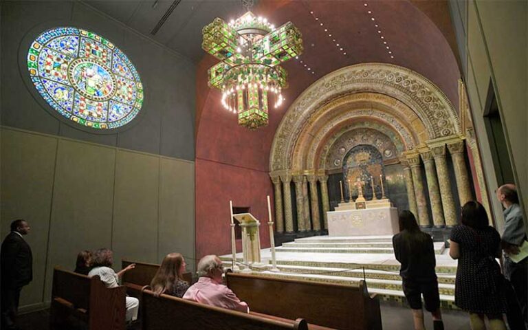 chapel area with stained glass chandelier and rose window at morse museum orlando