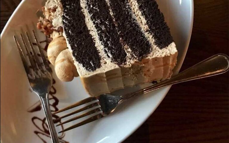 chocolate cake plated with fork and glaze at biscottis jacksonville