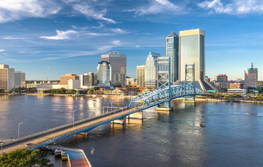 city skyline with river bridge and cloud streaked sky jacksonville fun facts post