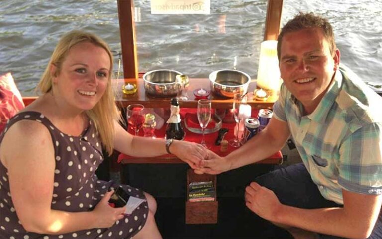 couple having champagne seated at table on boat at las olas gondola fort lauderdale