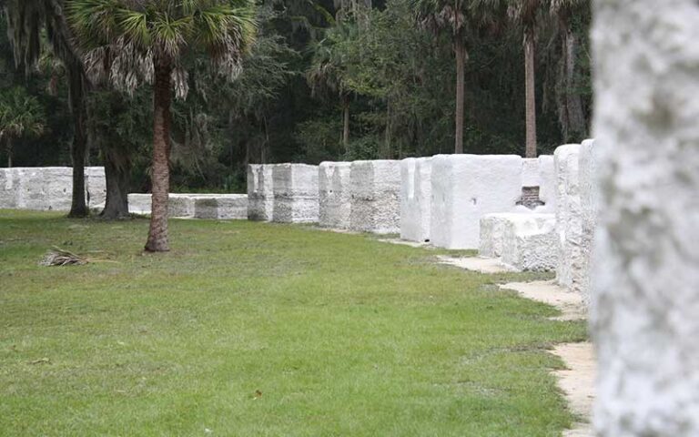 curving row of white stucco structures at kingsley plantation jacksonville