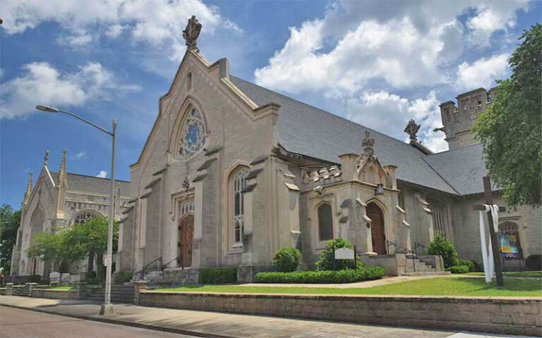 daytime exterior of church with gothic architecture at st johns cathedral jacksonville