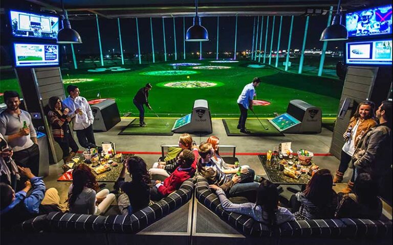 driving range with stalls with lounges on each at topgolf jacksonville