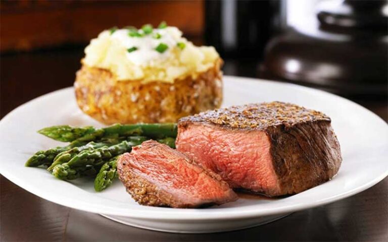 filet mignon with asparagus and baked potato at teds montana grill jacksonville
