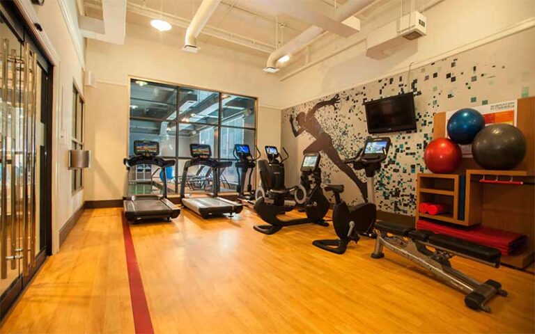 fitness room with wood floor cardio and weights at sheraton hotel jacksonville