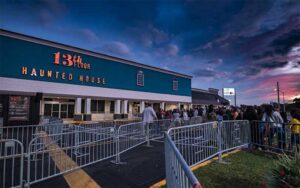 front exterior at night with sign and lines at 13th floor haunted house jacksonville