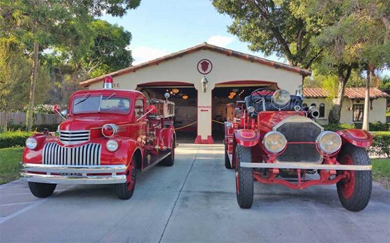 front exterior facing garage with two trucks at fort lauderdale fire safety museum