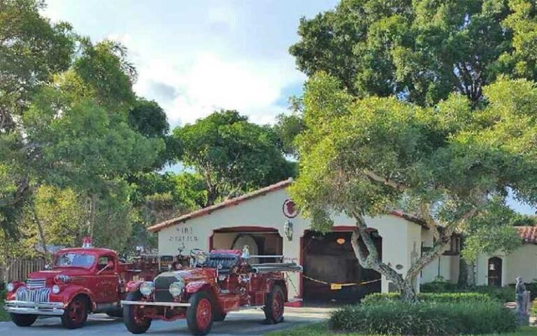 front exterior of firehouse museum with two classic fire trucks at fort lauderdale fire safety museum