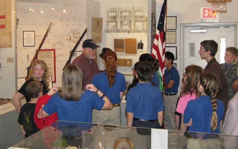 man talking to children about civil war at museum of southern history jacksonville