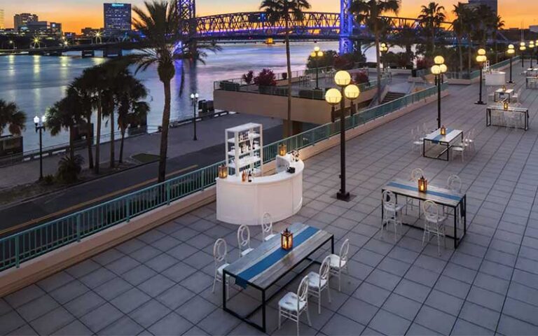 outdoor dining rooftop with river view and sunset at hyatt regency jacksonville riverfront