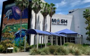 outdoor front of building with sign and space mural at mosh museum of science history jacksonville