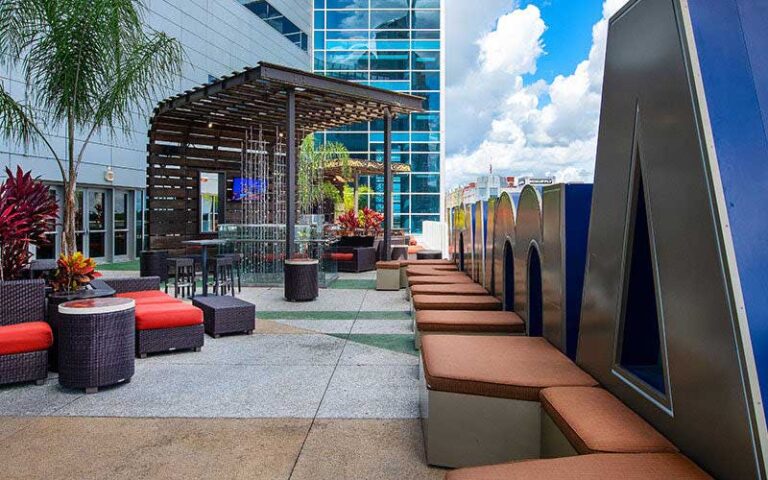 outer balcony with letter a and tables and chairs at amway center orlando