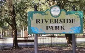 park area with trees and sign with name at riverside park jacksonville