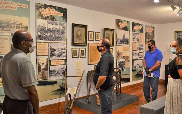 patrons looking at wall exhibits at history fort lauderdale museum