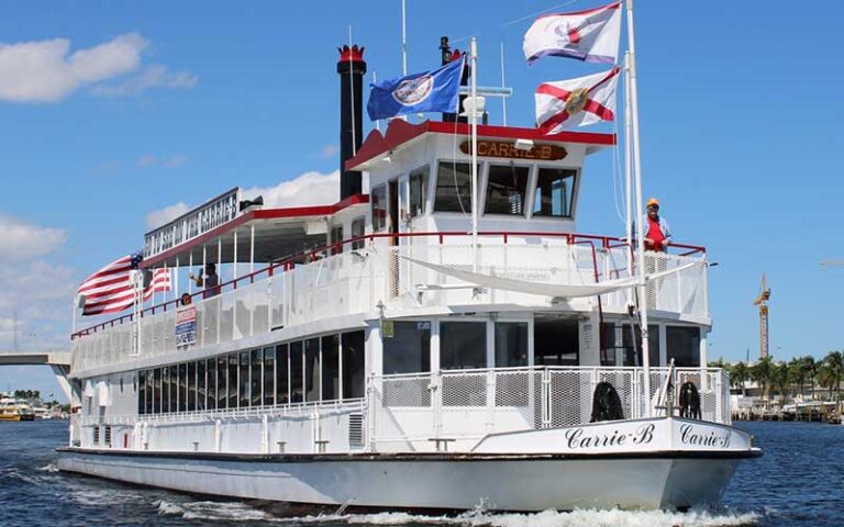 riverboat with tour facilities and flags at carrie b cruises ft lauderdale