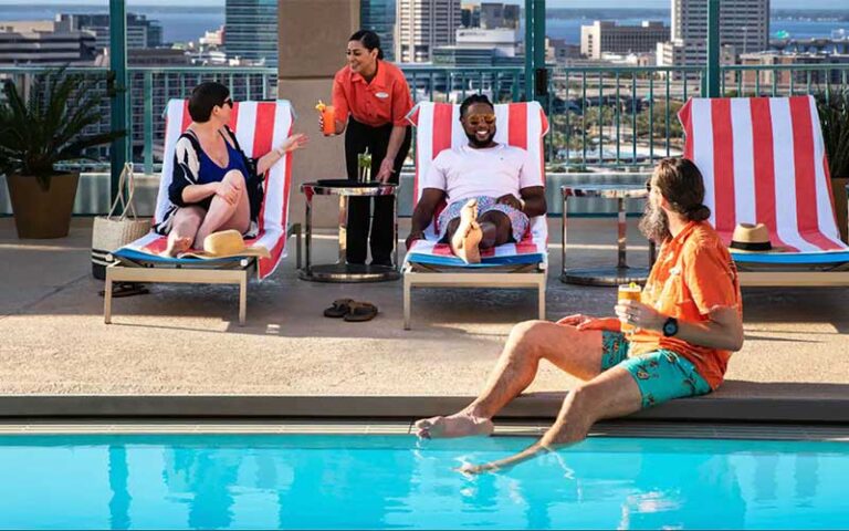 rooftop pool with people waitress serving drink at hyatt regency jacksonville riverfront