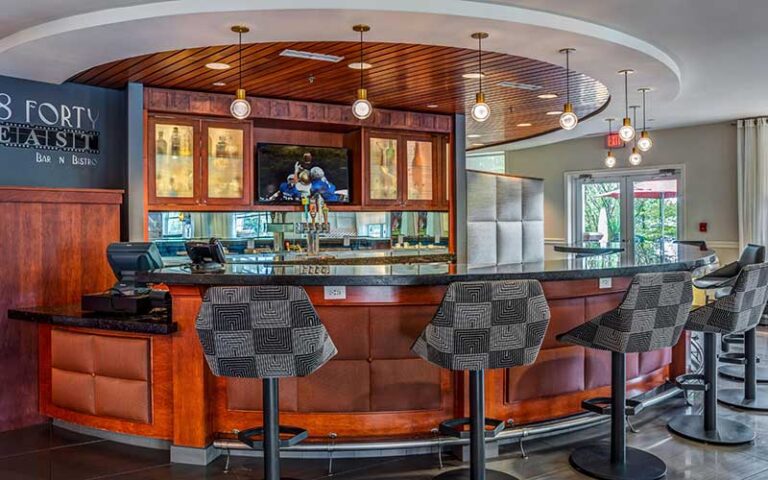 round bar area with cherry wood at hotel indigo jacksonville deerwood park