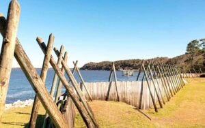 row of fortress stakes and barrier fence along shore at fort caroline national memorial jacksonville