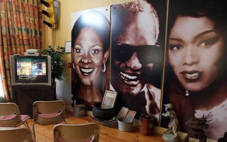 row of portraits with film watching area at wells built museum orlando